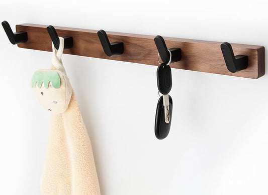 IURRDOP 17 Inch Walnut Wood Wall Mounted Coat Rack with 5 Black Hooks, Adhesive Mounted Entryway Hooks, Modern Natural Wooden Pegs for Hanging Coat Clothes Hat Bag Purse Key and Towel